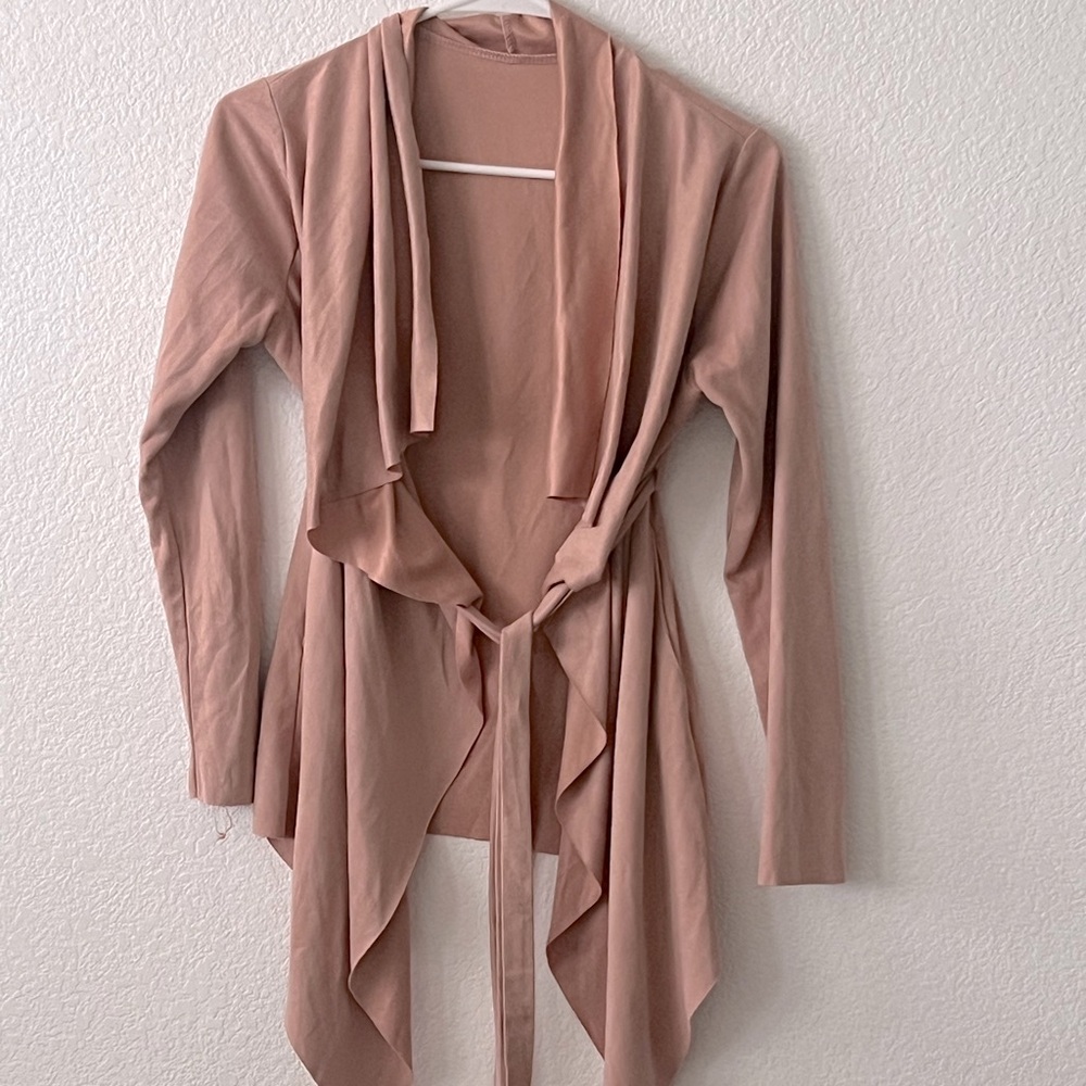 3/4 length sleeve over layer with belt.